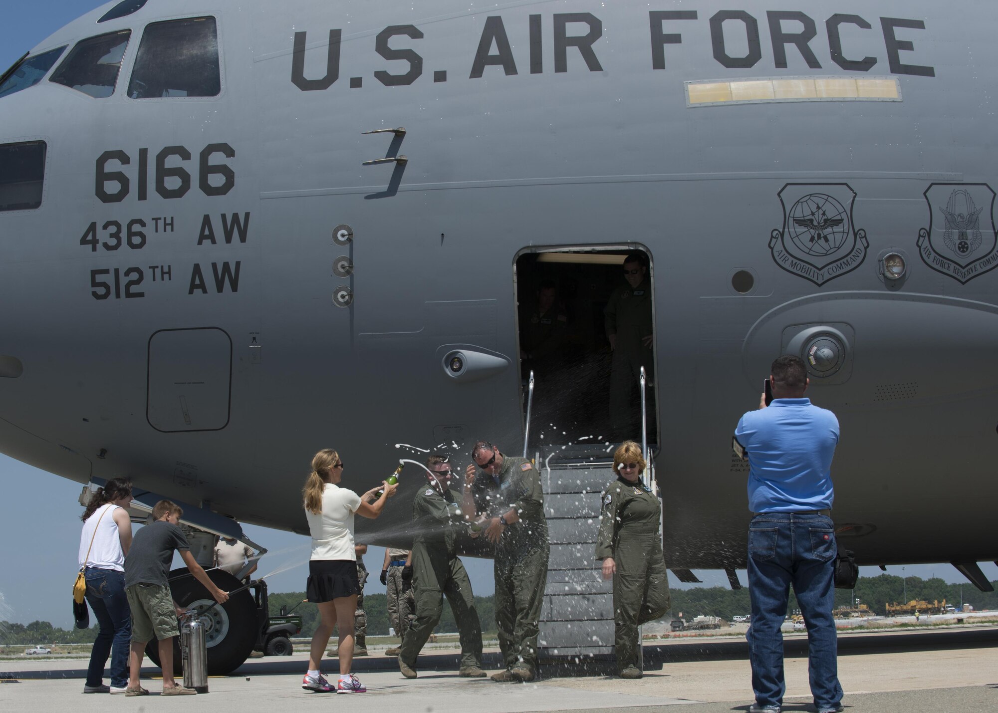 Maj. Christian Fiore and Senior Master Sgt. Kathleen Lambert, 512th Airlift Wing members, celebrated their final flight with friends and family June 27, 2016, at Dover Air Force Base, Del. Fiore has been at DAFB since 1991 and started his pilot training on this same day 14 years ago. Lambert has served with the 512th AW for 33 years and logged more than 11,000 flight hours. (U.S. Air Force Photo/ Tech. Sgt. Nathan Rivard)
