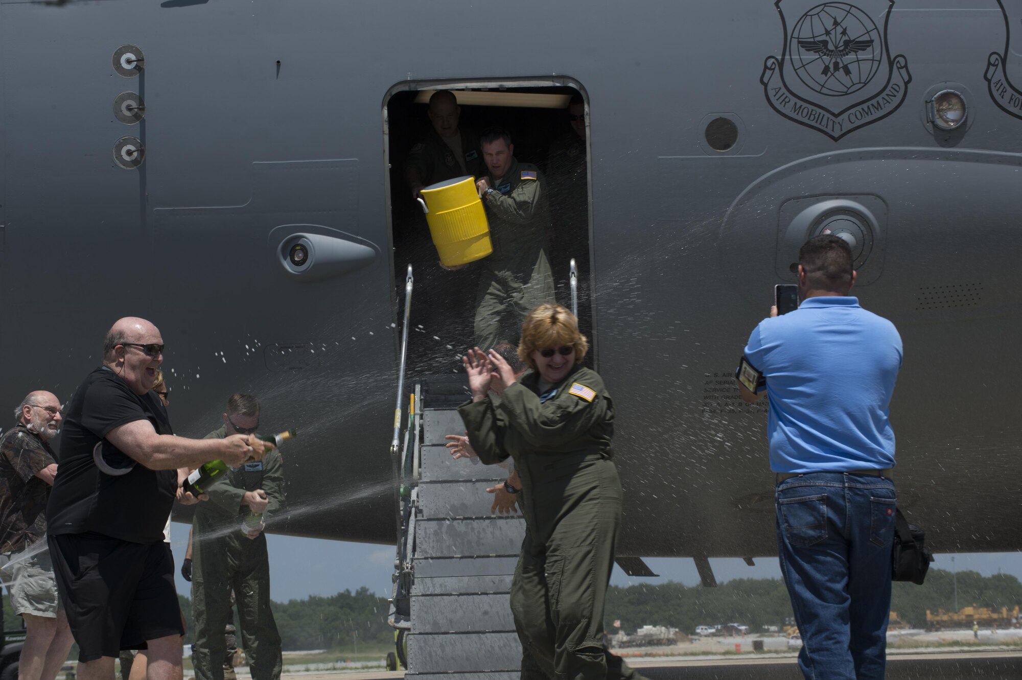 Maj. Christian Fiore and Senior Master Sgt. Kathleen Lambert, 512th Airlift Wing members, celebrated their final flight with friends and family June 27, 2016, at Dover Air Force Base, Del. Fiore has been at DAFB since 1991 and started his pilot training on this same day 14 years ago. Lambert has served with the 512th AW for 33 years and logged more than 11,000 flight hours. (U.S. Air Force Photo/ Tech. Sgt. Nathan Rivard)