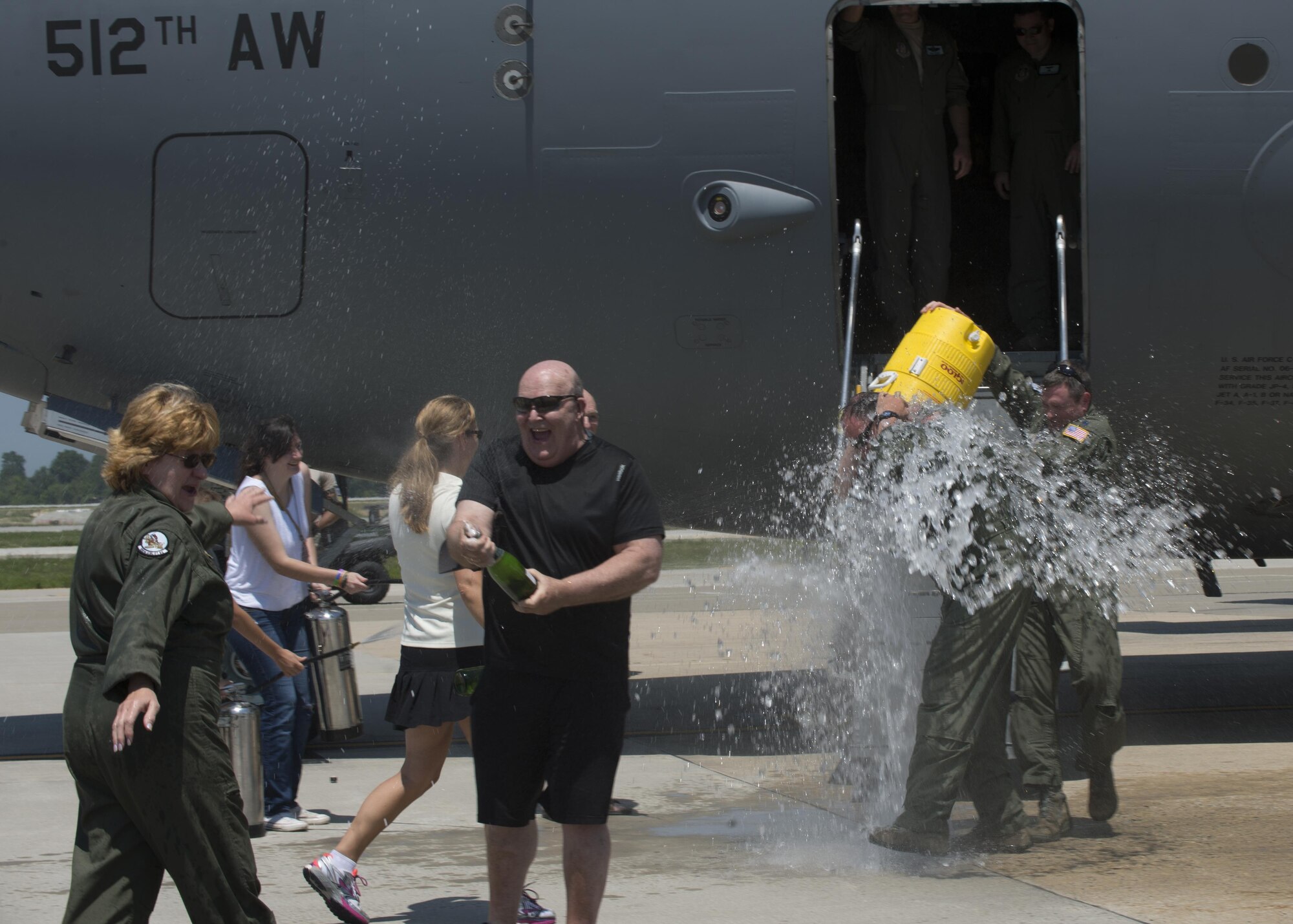 Maj. Christian Fiore and Senior Master Sgt. Kathleen Lambert, 512th Airlift Wing members, celebrated their final flight with friends and family June 27, 2016, at Dover Air Force Base, Del. Fiore has been at DAFB since 1991 and started his pilot training on this same day 14 years ago. Lambert has served with the 512th AW for 33 years and logged more than 11,000 flight hours. (U.S. Air Force Photo/ Tech. Sgt. Nathan Rivard)