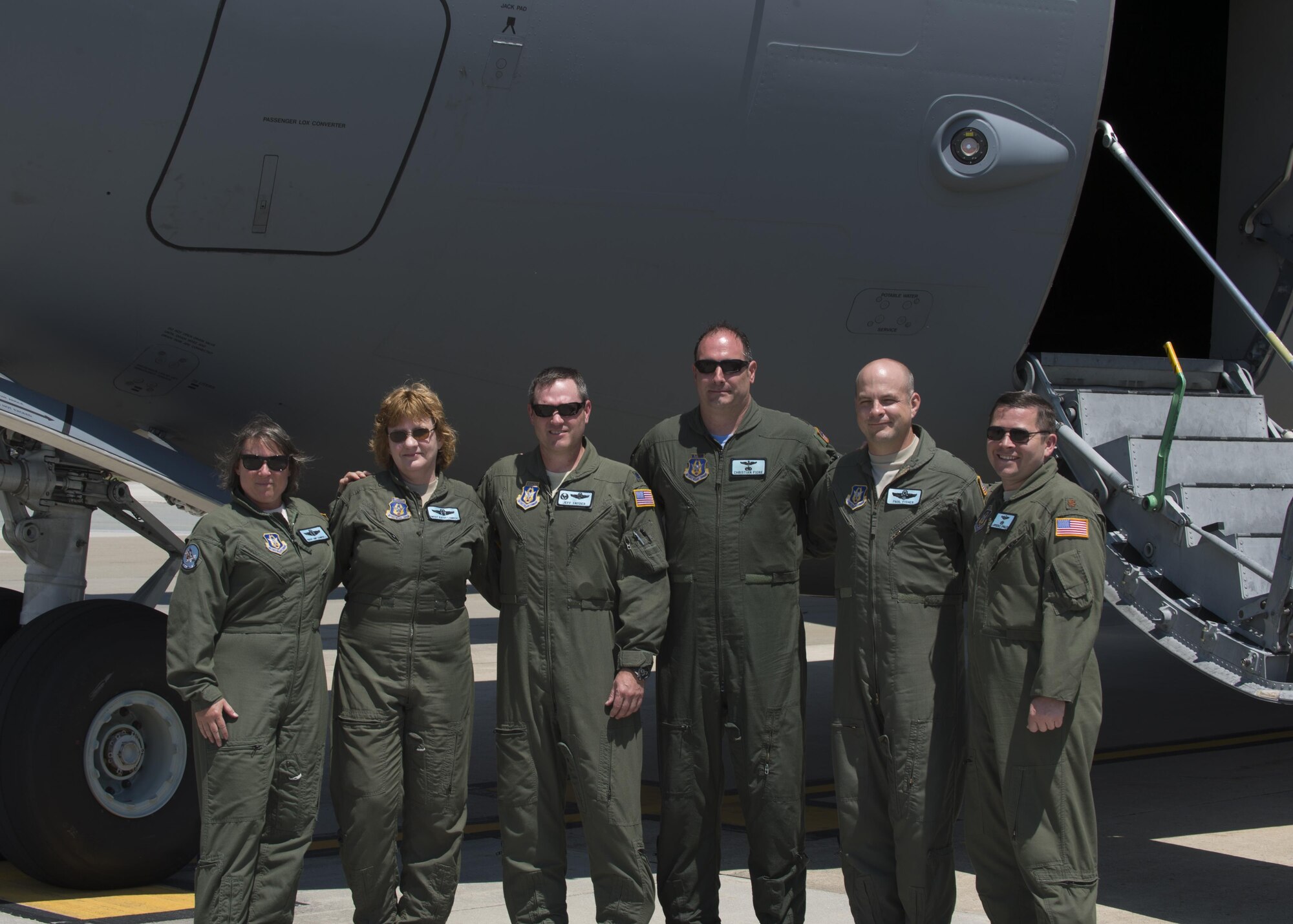 Maj. Christian Fiore and Senior Master Sgt. Kathleen Lambert, 512th Airlift Wing members, celebrated their final flight with friends and family June 27, 2016, at Dover Air Force Base, Del. Fiore has been at DAFB since 1991 and started his pilot training on this same day 14 years ago. Lambert has served with the 512th AW for 33 years and logged more than 11,000 flight hours. (U.S. Air Force Photo/ Tech. Sgt. Nathan Rivard)