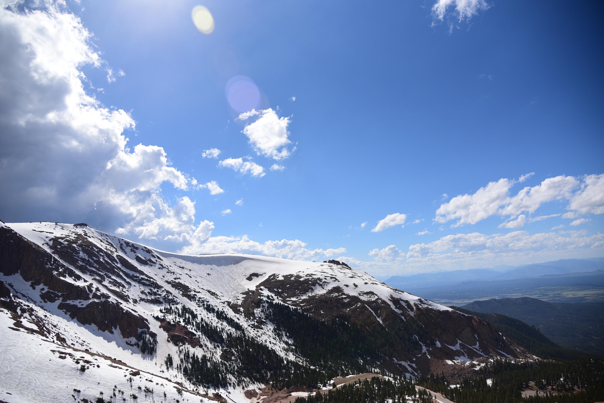 Cascade, Colo. - Snow shines bright on the side of Pikes Peak on June 5, 2016. With temperatures barely reaching 40 degrees even in the summer, snow can be seen on the summit year round.  (U.S. Air Force photo by Staff Sgt. Amber Grimm)