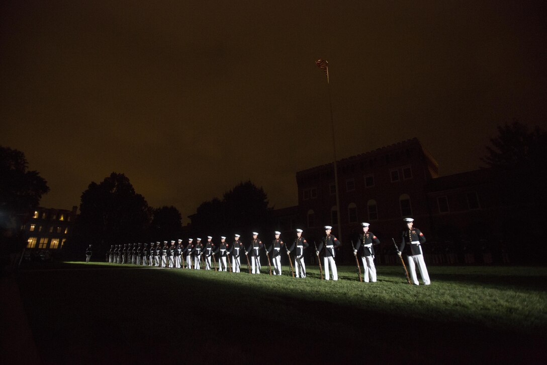 The United States Marine Silent Drill Platoon performs during the Friday Evening Parade at Marine Barracks Washington, D.C., Jun. 24, 2016. The guest of honor for the parade was the Honorable Angus S. King Jr., United States Senator for Maine, and the hosting official was Lt. Gen. James B. Laster, director, Marine Corps Staff. (Official Marine Corps photo by Cpl. Chi Nguyen/Released)
