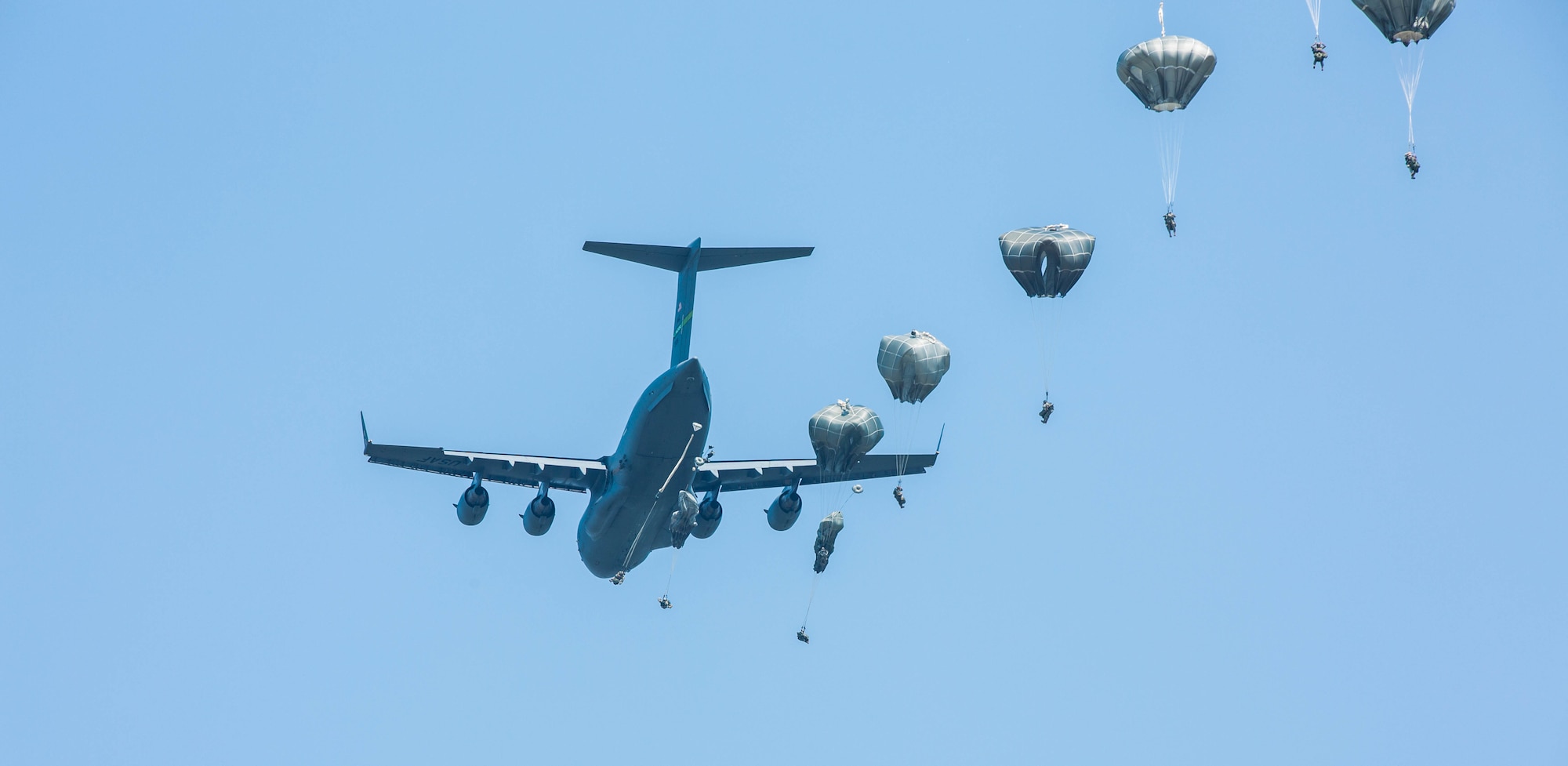 U.S. Army paratroopers, from the 82nd Airborne Infantry Division, jump out of a C-17 Globemaster III during exercise Central Accord 2016 in Gabon, June 20, 2016. The U.S. Army Africa exercise is an annual, combined, joint military exercise that brings together partner nations to practice and demonstrate proficiency in conducting peacekeeping operations. (U.S. Army photo/Spc. Audrequez Evans)