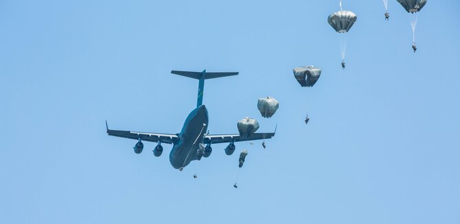 U.S. Army paratroopers, from the 82nd Airborne Infantry Division, jump out of a C-17 Globemaster III during exercise Central Accord 2016 in Gabon, June 20, 2016. The U.S. Army Africa exercise is an annual, combined, joint military exercise that brings together partner nations to practice and demonstrate proficiency in conducting peacekeeping operations. (U.S. Army photo/Spc. Audrequez Evans)