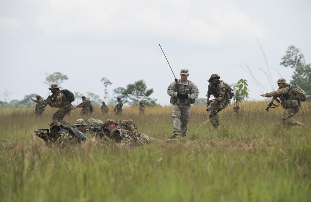 A U.S. Army infantryman and a Cameroonian armed forces soldier work alongside one another to secure a checkpoint during a simulated tactical movement at exercise Central Accord 2016 in Libreville, Gabon, June 21, 2016. The U.S. Army Africa exercise is an annual, combined, joint military exercise that brings together partner nations to practice and demonstrate proficiency in conducting peacekeeping operations. (DOD  photo/Tech. Sgt. Brian Kimball)