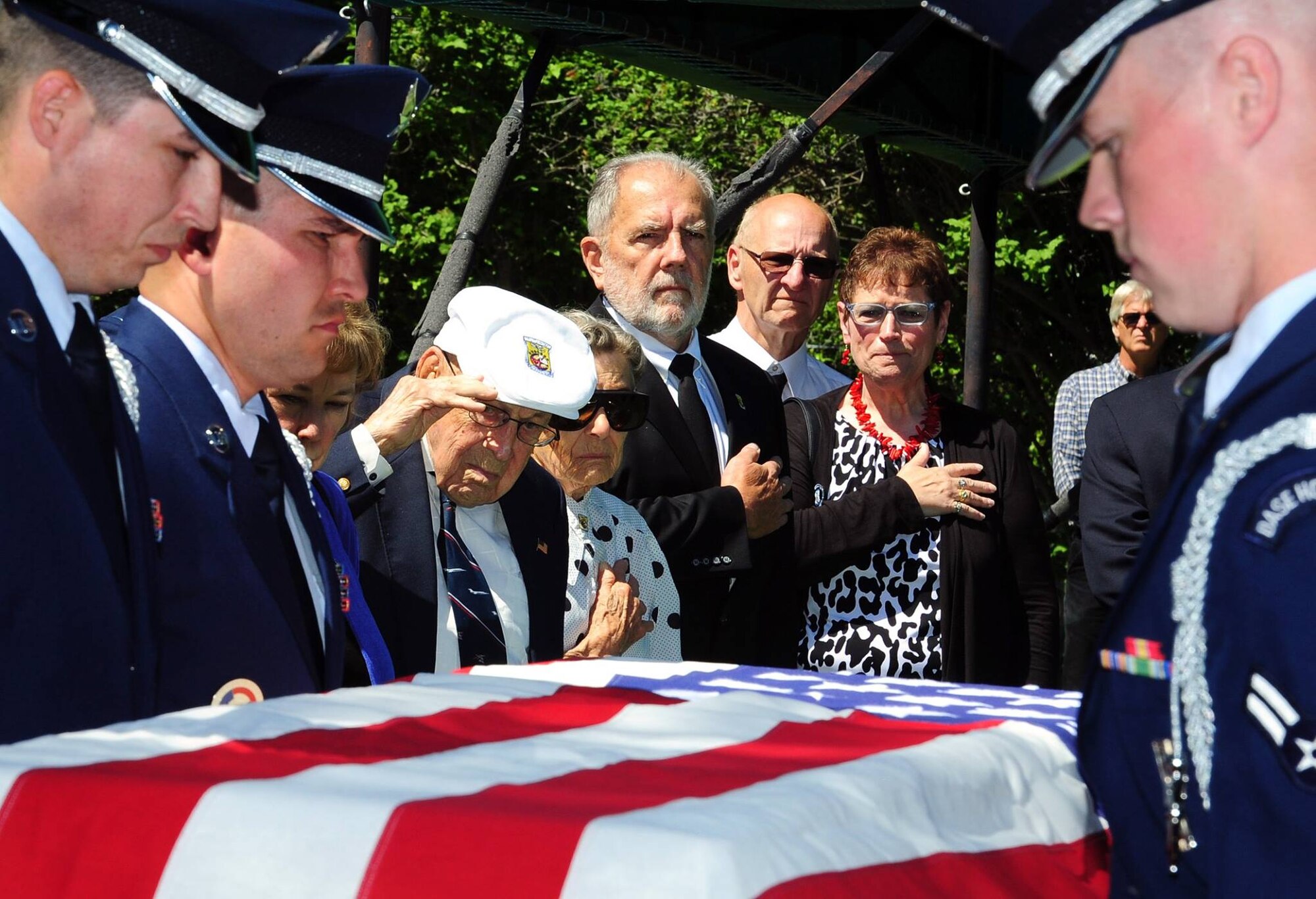 Retired Lt. Col. Richard Cole, the last surviving Doolittle Raider, center, salutes as members of the Malmstrom Air Force Base Honor Guard render military honors during a funeral service in honor of Staff Sgt. David J. Thatcher June 27, 2016, in Missoula, Mont. Thatcher was the second to last remaining Doolittle Raider and is a recipient of the Congressional Gold Medal and Air Force Silver Star. His other decorations include the Distinguished Flying Cross, Air Medal with four oak leaf clusters, and the Chinese Army, Navy and Air Corps Medal. (U.S. Air Force photo by 2nd Lt. Annabel Monroe)