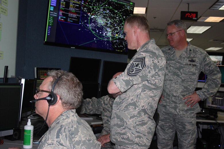 Chief Master Sgt. of the Air Force James Cody, center, visited the Western Air Defense Sector May 4.  Cody received a first hand tour of the WADS operations floor and learned how members of the unit identify, detect and defend against airborne threats over the western portion of the continental U.S. 