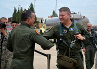 Brig. Gen. Scott Pleus, 56th Fighter Wing commander, is congratulated by Col. David Shoemaker, 56th Fighter Wing vice commander, after his final flight in an F-35 Lightning II June 27, 2016 at Luke Air Force Base, Ariz. His two-year tenure as commander was filled with change as the wing shifted its mission to include the F-35. (U.S. Air Force photo by Senior Airman Devante Williams)