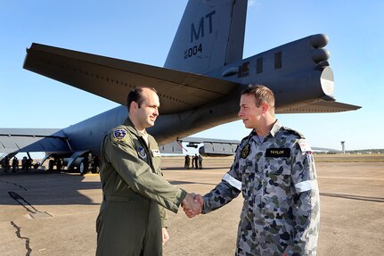 Able Seaman Ryan Taylor an Electronic Warfare Operator from Headquarters NORCOM thanks Captain 'Strong' Calkins an Electronic Warfare Officer with the United States Air Force for the tour of a B-52 Stratofortress aircraft.