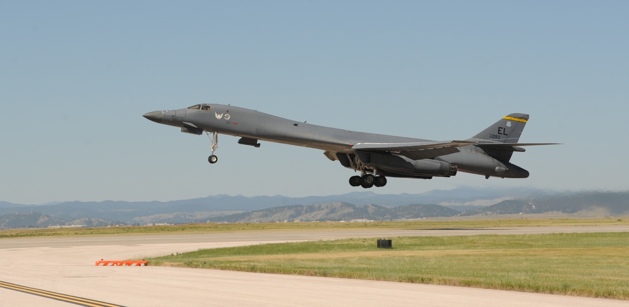 A B-1 bomber takes off From Ellsworth Air Force Base, S.D., to perform a flyover in honor of U.S. Army Air Corps Staff Sgt. David Thatcher, June 27, 2016. Thatcher was the engineer gunner of a B-25 medium-range bomber on Crew #7, “The Ruptured Duck,” during the Doolittle Raid on April 18, 1942. (U.S. Air Force photo by Airman 1st Class Denise M. Nevins/Released)