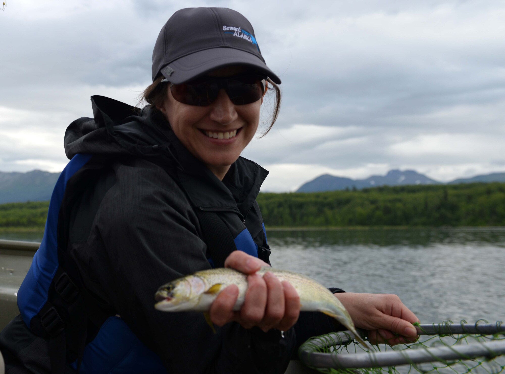 Crystal Palmer, an experienced fisher, shows off her days catch at the Introduction to Fishing Class, at Otter Lake at Joint Base Elmendorf-Richardson, Alaska, June 23, 2016. Alaska fishing guides and regulations can be found at the JBER Outdoor Recreation Center, Base Exchange, and most sporting goods stores. (U.S. Air Force photo by Airman 1st Class Javier Alvarez)