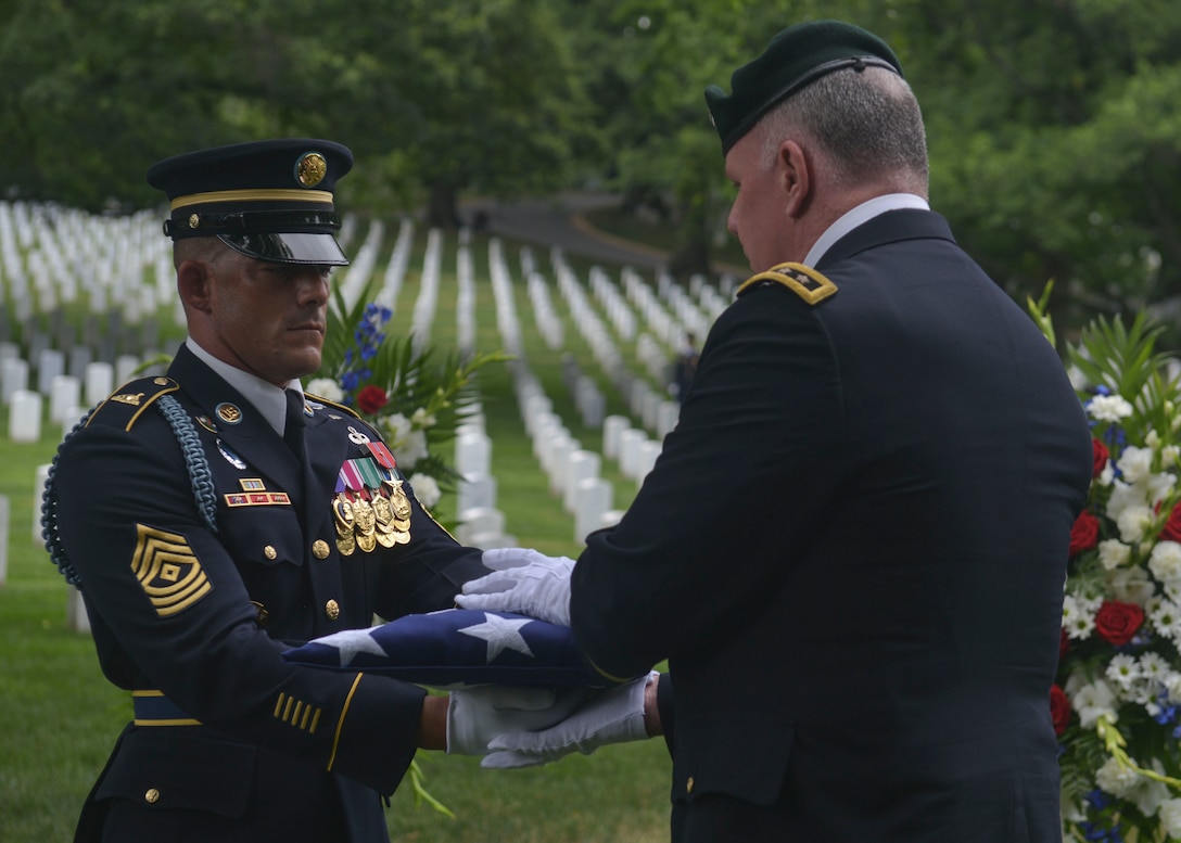 U.S. Army officials pass off the flag from the casket of returned Sgt. 1st Class Alan Boyer who had been Missing In Action for over 48 years during his funeral service held at the Arlington National Cemetery, June 22, 2016. “Alan went missing during a top secret mission in Laos on March 28, 1968,” said Judi Boyer-Bouchard sister of Alan Boyer. “Over the last 48 years they have conducted investigations and excavations without finding anything, but early this year in March I received a call saying they [The Defense POW/MIA Accounting Agency] found the remains.” Boyer was buried with full military honors, and will forever be laid to rest surrounded by his brother and sisters in arms in the Arlington National Cemetery, including his best friend U.S. Army 1st Lt. Loren Hagen who is buried a few plots away from Boyer’s final resting place.