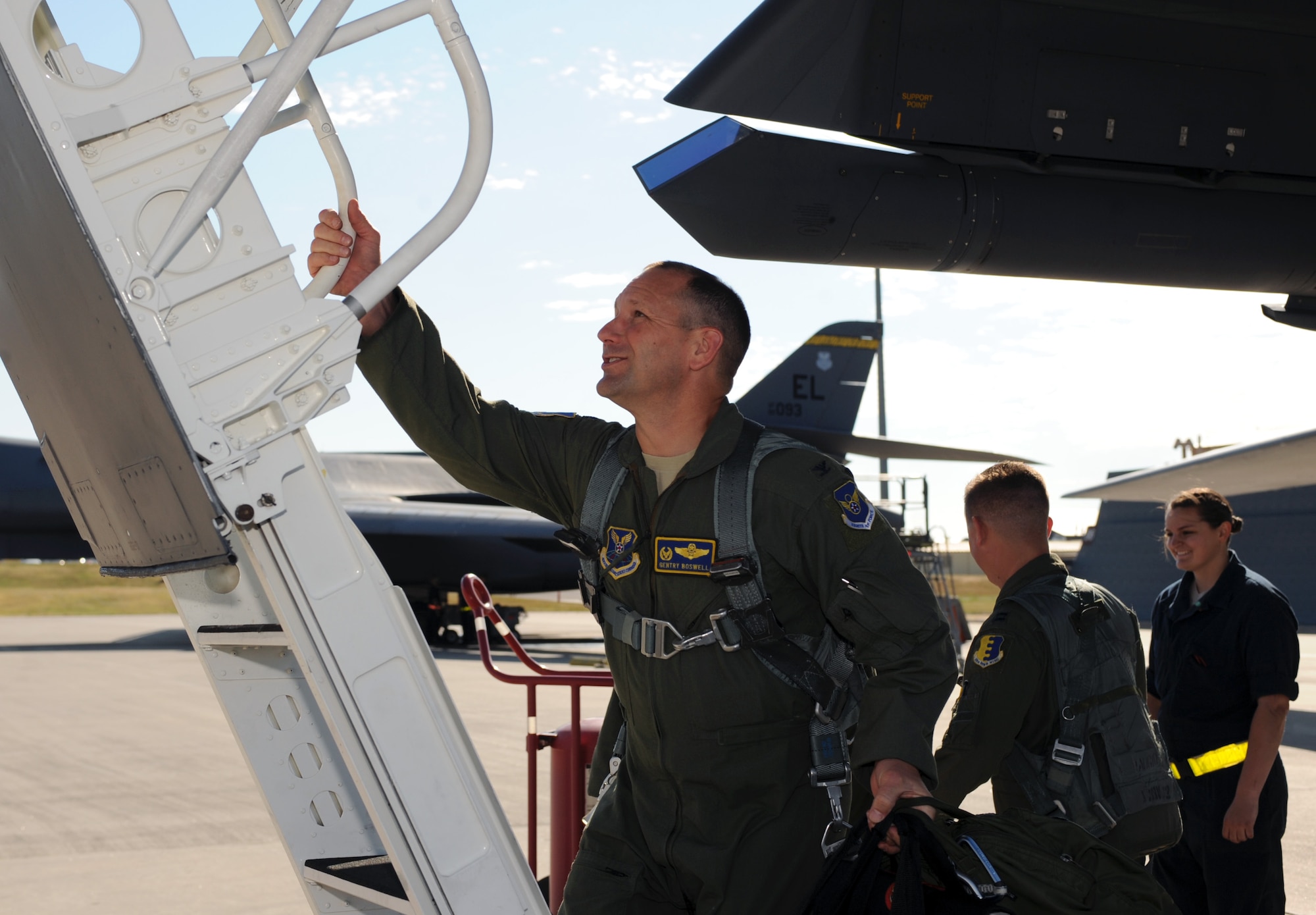 Col. Gentry Boswell, 28th Bomb Wing commander, boards a B-1 bomber to perform a flyover to honor the passing of U.S. Army Air Corps Staff Sgt. David Thatcher at Ellsworth Air Force Base, S.D., June 27, 2016. Thatcher was the engineer gunner of the original Ruptured Duck, one of 16 B-25 Mitchell bombers that launched off the deck of the aircraft carrier the U.S.S. Hornet and headed to the coast of Japan to wreak havoc on the Japanese empire April 18, 1942. (U.S. Air Force photo by Airman 1st Class Denise M. Nevins/Released)