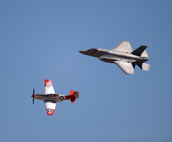 An F-35 Lightning II and a vintage P-51 aircraft perform for spectators during the Warriors Over the Wasatch Air Show and Open House June 26 at Hill Air Force Base, Utah. The Air Combat Command Air Force Heritage Flight program features modern U.S. Air Force fighter aircraft flying alongside World War II, Korean-era, and Vietnam-era aircraft in a dynamic display of our nation’s airpower history. (U.S. Air Force photo by Todd Cromar)