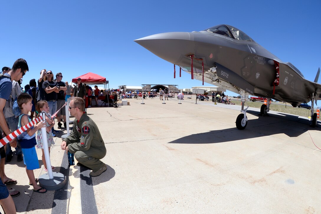 An Airman talks with Warriors Over the Wasatch Air Show and Open House attendees June 26 at Hill Air Force Base, Utah. The air show and open house drew hundreds of thousands of visitors during its 2-day run. (U.S. Air Force photo by Todd Cromar)