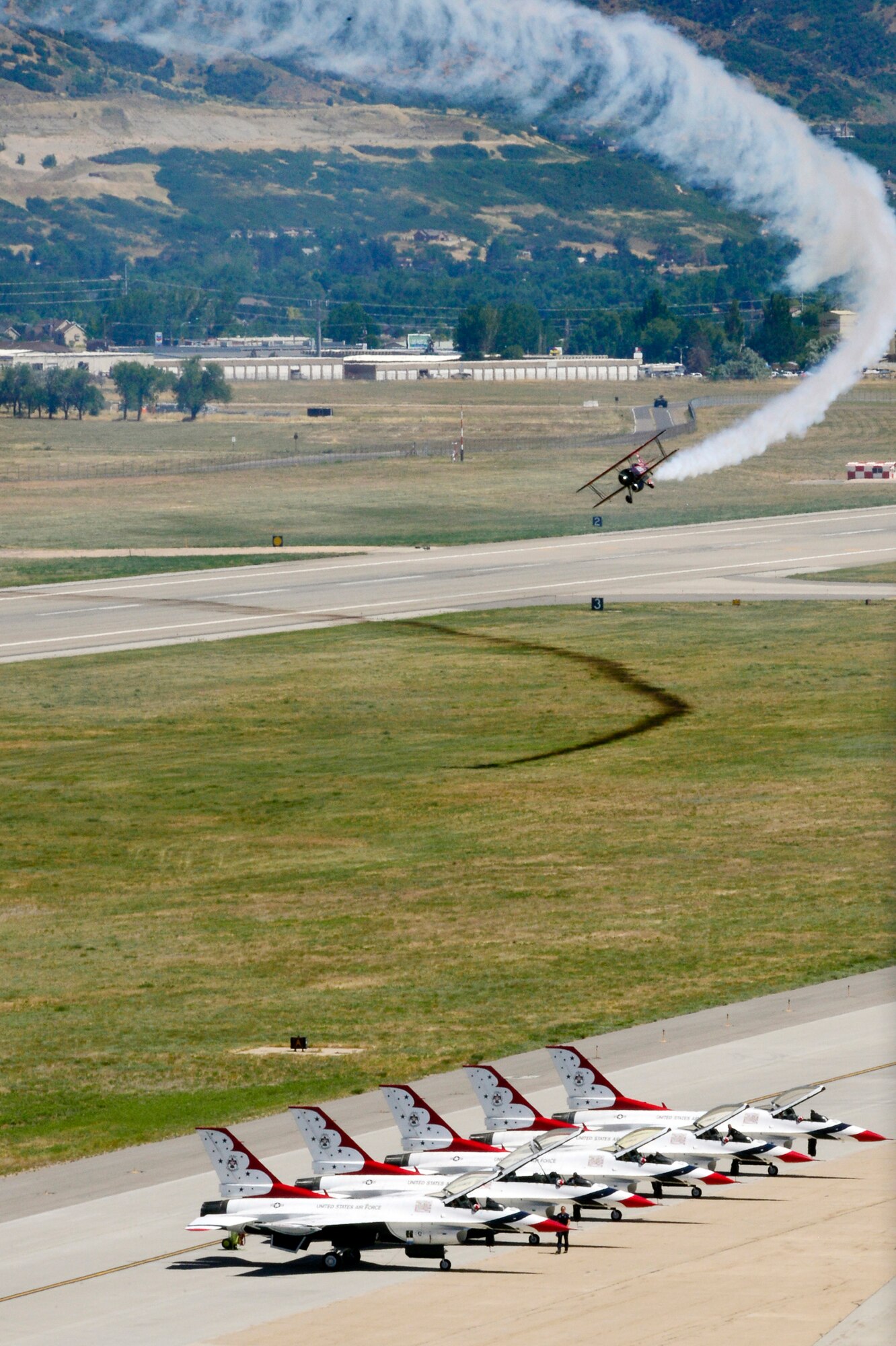 John Klatt flies his Waco aircraft during the Warriors Over the Wasatch air show June 25 at Hill Air Force Base. Klatt was one of more than 20 performers who entertained hundreds of thousands during the 2-day event at the base. (U.S. Air Force photo by David Perry)