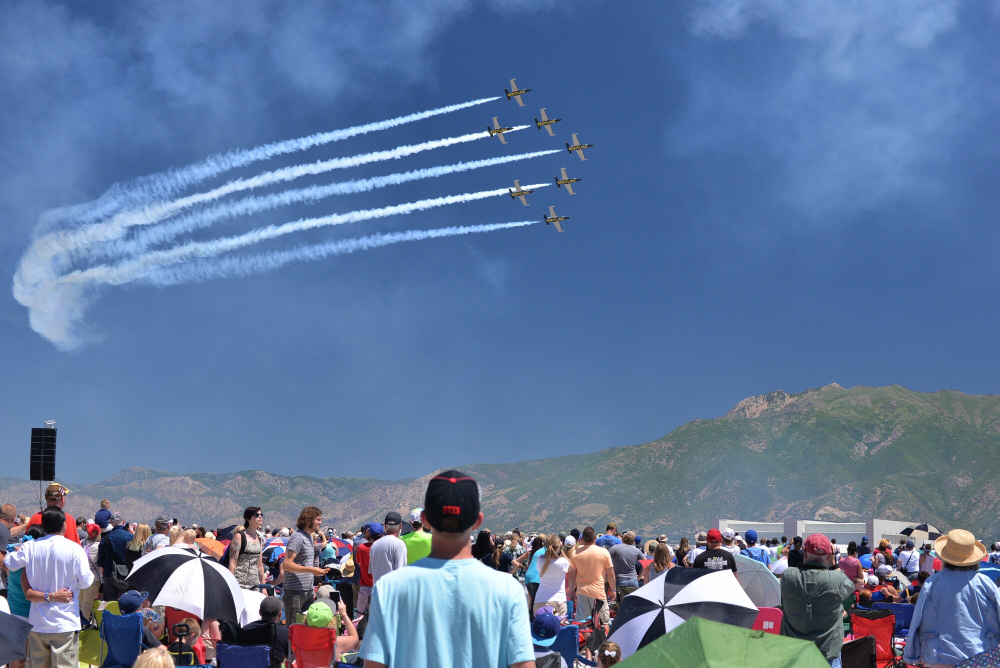 Air show spectators watch the Breitling Jet Team pass by during the 2016 Warriors Over the Wasatch Air Show and Open House at Hill Air Force Base, June 26. (U.S. Air Force photo by R. Nial Bradshaw)