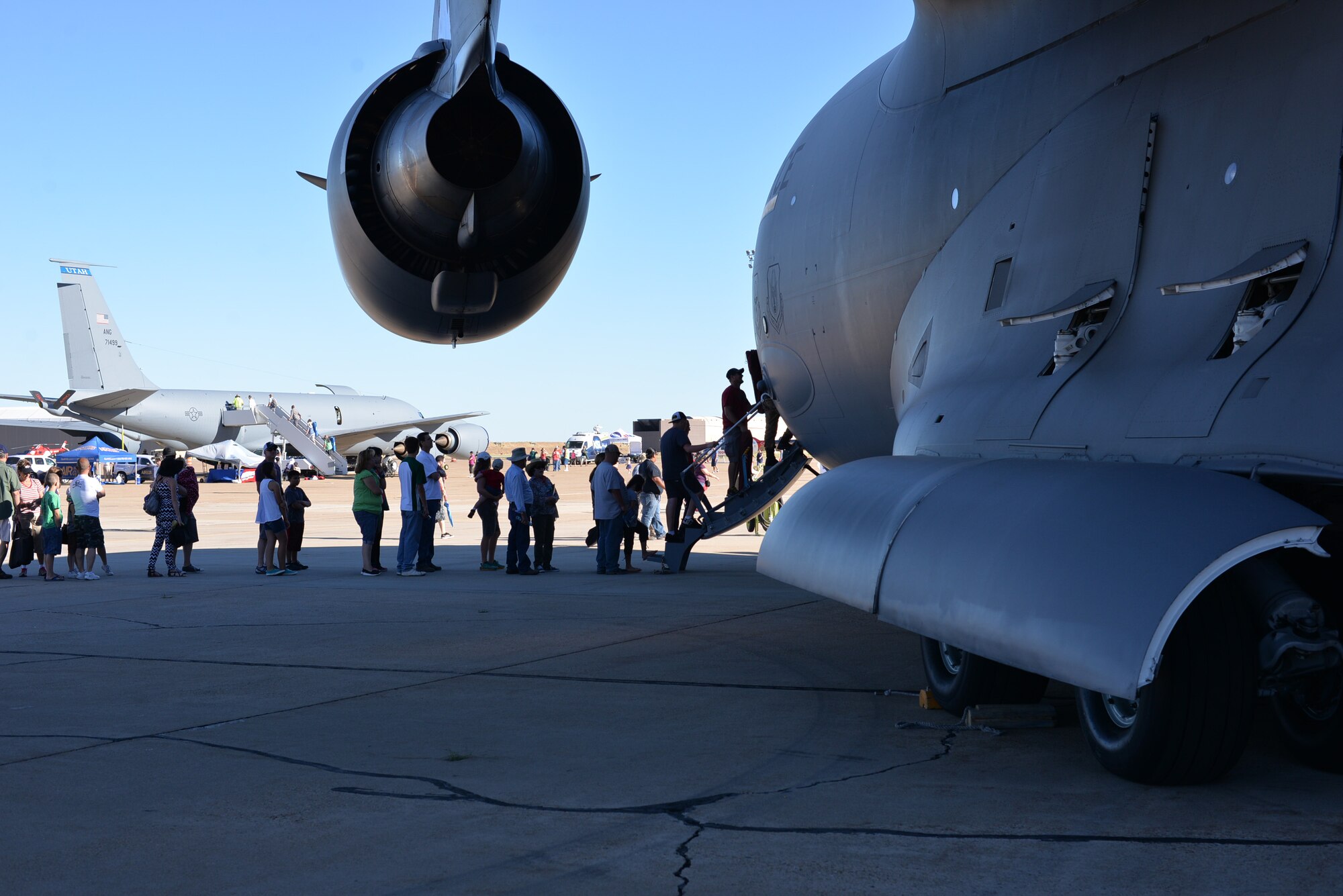 Air show visitors walk through a C-17 Globemaster III aircraft June 26 at Hill Air Force Base, Utah. Hundreds of thousands attended the 2-day Warriors Over the Wasatch Air Show and Open House at the base. (U.S. Air Force photo by R. Nial Bradshaw)