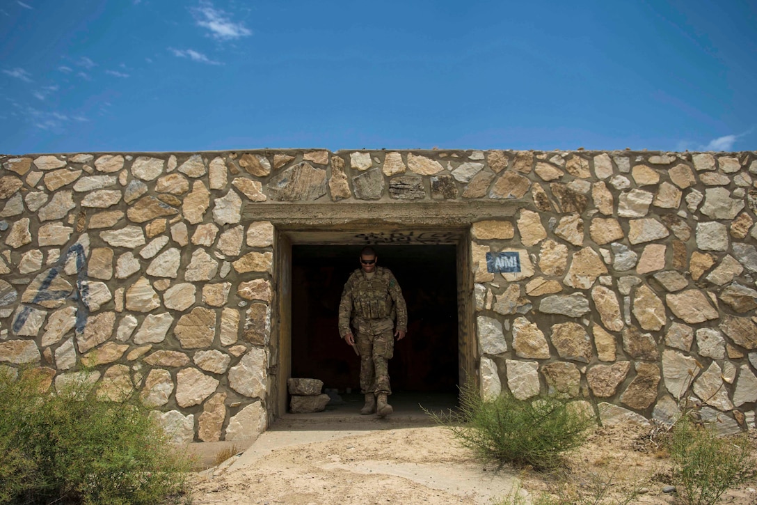 Air Force Staff Sgt. Gary Allsbrook exits an old bunker at Bagram Airfield, Afghanistan, June 27, 2016. Members of the 455th Expeditionary Security Forces Squadron quick reaction force check buildings and other areas on the flightline to deter threats. Air Force photo by Senior Airman Justyn M. Freeman