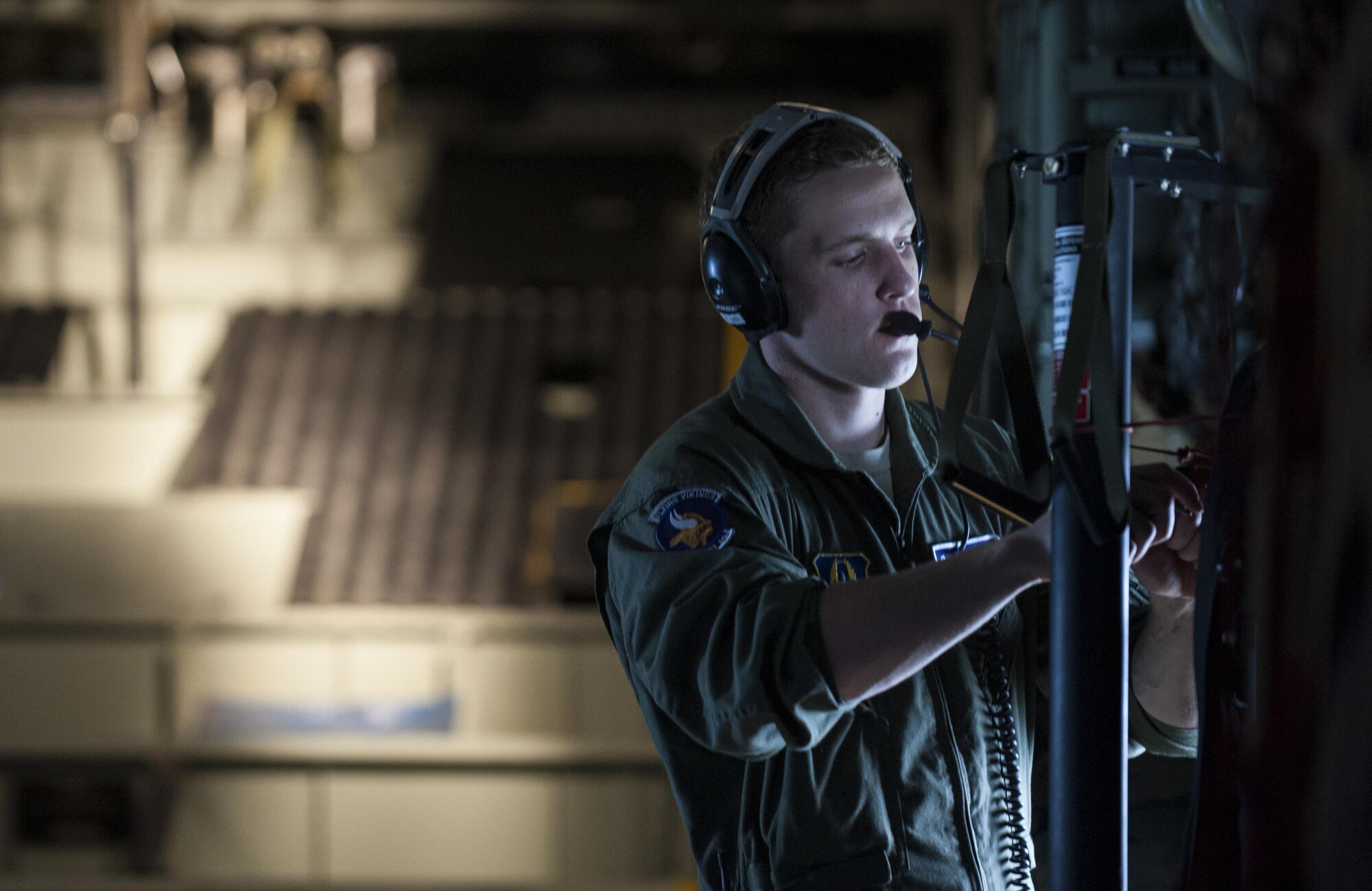 Senior Airman Alec Miller, a loadmaster with the 96th Airlift Squadron, secures a strap in a C-130H Hercules prior to releasing cargo during exercise Central Accord 2016 in Libreville, Gabon, June 18, 2016. The U.S. Army Africa exercise is an annual, combined, joint military exercise that brings together partner nations to practice and demonstrate proficiency in conducting peacekeeping operations. (DOD photo/Tech. Sgt. Brian Kimball)