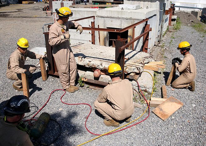 Marines and Sailors with Chemical Biological Incident Response Force train alongside the Fire Department of New York for a field training exercise at the F.D.N.Y. training academy in Randall’s Island, N.Y. June 20, 2016. CBIRF is an active duty Marine Corps unit that, when directed, forward-deploys and/or responds with minimal warning to a chemical, biological, radiological, nuclear or high-yield explosive (CBRNE) threat or event in order to assist local, state, or federal agencies and the geographic combatant commanders in the conduct of CBRNE response or consequence management operations, providing capabilities for command and control; agent detection and identification; search, rescue, and decontamination; and emergency medical care for contaminated personnel. (Official USMC Photo by Lance Cpl. Maverick S. Mejia/RELEASED)