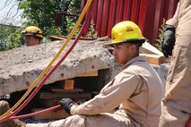 Marines and Sailors with Chemical Biological Incident Response Force train alongside the Fire Department of New York for a field training exercise at the F.D.N.Y. training academy in Randall’s Island, N.Y. June 20, 2016. CBIRF is an active duty Marine Corps unit that, when directed, forward-deploys and/or responds with minimal warning to a chemical, biological, radiological, nuclear or high-yield explosive (CBRNE) threat or event in order to assist local, state, or federal agencies and the geographic combatant commanders in the conduct of CBRNE response or consequence management operations, providing capabilities for command and control; agent detection and identification; search, rescue, and decontamination; and emergency medical care for contaminated personnel. (Official USMC Photo by Lance Cpl. Maverick S. Mejia/RELEASED)