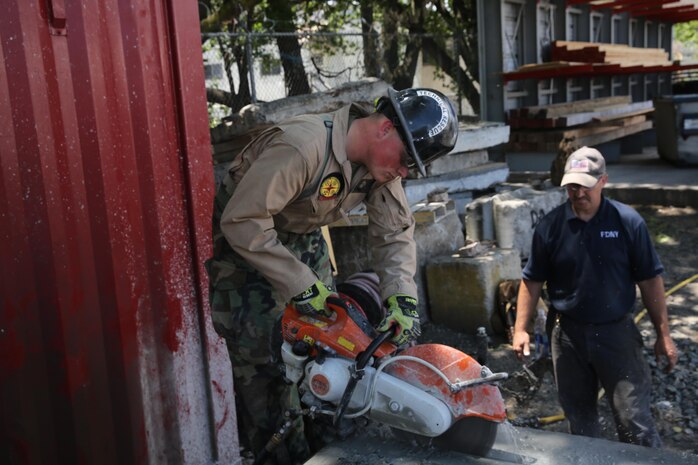 Marines and Sailors with Chemical Biological Incident Response Force train alongside the Fire Department of New York for a field training exercise at the F.D.N.Y. training academy in Randall’s Island, N.Y. June 20, 2016. CBIRF is an active duty Marine Corps unit that, when directed, forward-deploys and/or responds with minimal warning to a chemical, biological, radiological, nuclear or high-yield explosive (CBRNE) threat or event in order to assist local, state, or federal agencies and the geographic combatant commanders in the conduct of CBRNE response or consequence management operations, providing capabilities for command and control; agent detection and identification; search, rescue, and decontamination; and emergency medical care for contaminated personnel. (Official USMC Photo by Lance Cpl. Maverick S. Mejia/RELEASED)
