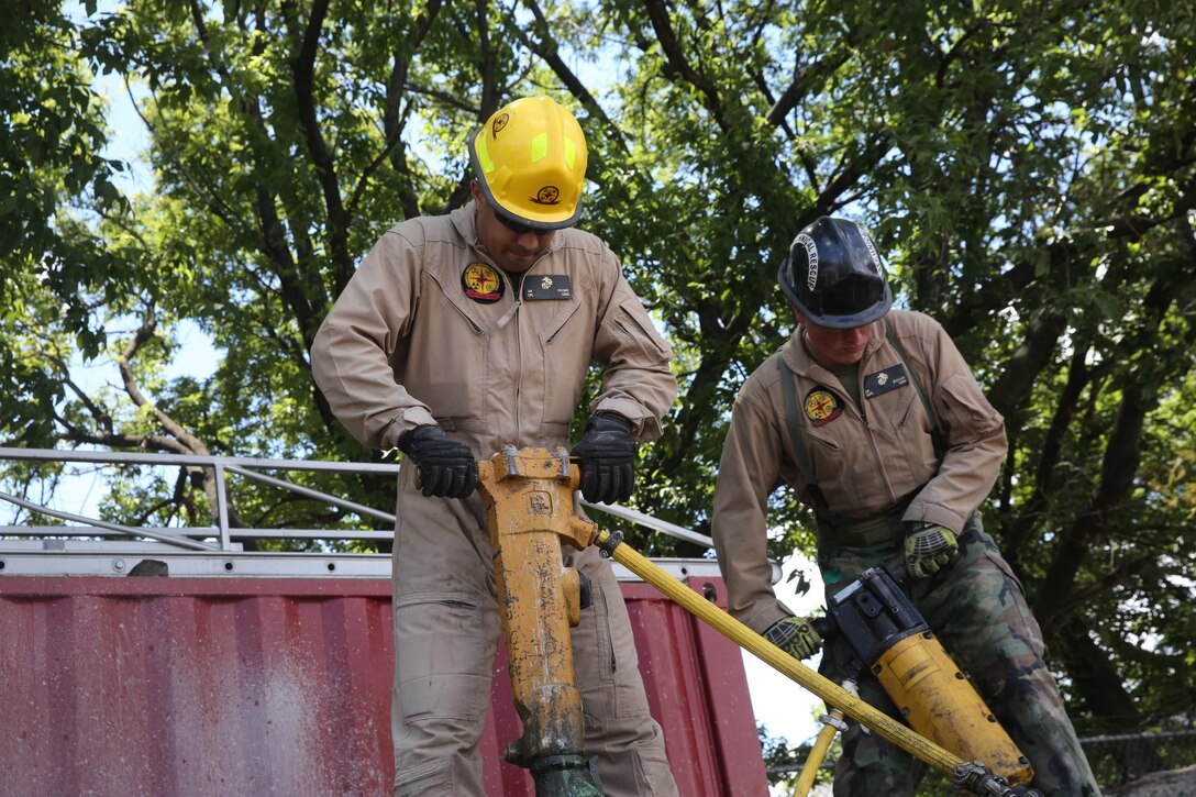 Marines and Sailors with Chemical Biological Incident Response Force train alongside the Fire Department of New York for a field training exercise at the F.D.N.Y. training academy in Randall’s Island, N.Y. June 20, 2016. CBIRF is an active duty Marine Corps unit that, when directed, forward-deploys and/or responds with minimal warning to a chemical, biological, radiological, nuclear or high-yield explosive (CBRNE) threat or event in order to assist local, state, or federal agencies and the geographic combatant commanders in the conduct of CBRNE response or consequence management operations, providing capabilities for command and control; agent detection and identification; search, rescue, and decontamination; and emergency medical care for contaminated personnel. (Official USMC Photo by Lance Cpl. Maverick S. Mejia/RELEASED)
