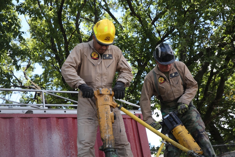 Marines and Sailors with Chemical Biological Incident Response Force train alongside the Fire Department of New York for a field training exercise at the F.D.N.Y. training academy in Randall’s Island, N.Y. June 20, 2016. CBIRF is an active duty Marine Corps unit that, when directed, forward-deploys and/or responds with minimal warning to a chemical, biological, radiological, nuclear or high-yield explosive (CBRNE) threat or event in order to assist local, state, or federal agencies and the geographic combatant commanders in the conduct of CBRNE response or consequence management operations, providing capabilities for command and control; agent detection and identification; search, rescue, and decontamination; and emergency medical care for contaminated personnel. (Official USMC Photo by Lance Cpl. Maverick S. Mejia/RELEASED)

