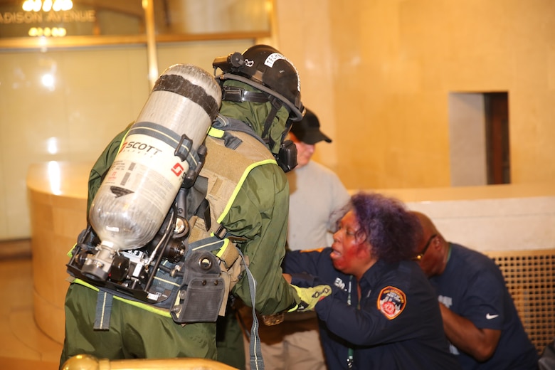 Marines and Sailors with Chemical Biological Incident Response Force train alongside the Fire Department of New York for a field training exercise at the F.D.N.Y. training academy in Randall’s Island, N.Y. June 20, 2016. CBIRF is an active duty Marine Corps unit that, when directed, forward-deploys and/or responds with minimal warning to a chemical, biological, radiological, nuclear or high-yield explosive (CBRNE) threat or event in order to assist local, state, or federal agencies and the geographic combatant commanders in the conduct of CBRNE response or consequence management operations, providing capabilities for command and control; agent detection and identification; search, rescue, and decontamination; and emergency medical care for contaminated personnel. (Official USMC Photo by Lance Cpl. Maverick S. Mejia/RELEASED)