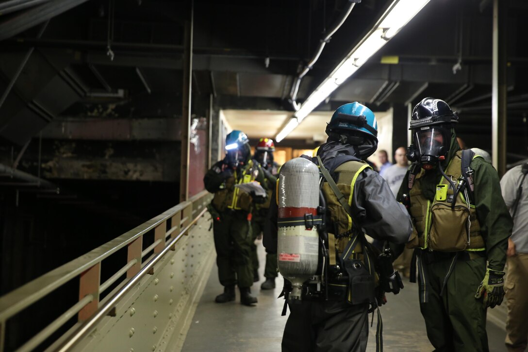 Marines and Sailors with Chemical Biological Incident Response Force train alongside the Fire Department of New York for a field training exercise at the F.D.N.Y. training academy in Randall’s Island, N.Y. June 20, 2016. CBIRF is an active duty Marine Corps unit that, when directed, forward-deploys and/or responds with minimal warning to a chemical, biological, radiological, nuclear or high-yield explosive (CBRNE) threat or event in order to assist local, state, or federal agencies and the geographic combatant commanders in the conduct of CBRNE response or consequence management operations, providing capabilities for command and control; agent detection and identification; search, rescue, and decontamination; and emergency medical care for contaminated personnel. (Official USMC Photo by Lance Cpl. Maverick S. Mejia/RELEASED)
