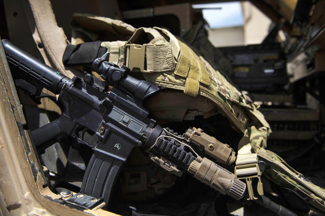 A weapon and gear sits in a tactical vehicle before an airman participates in a security patrol on the flightline at Bagram Airfield, Afghanistan, June 27, 2016. Air Force photo by Senior Airman Justyn M. Freeman