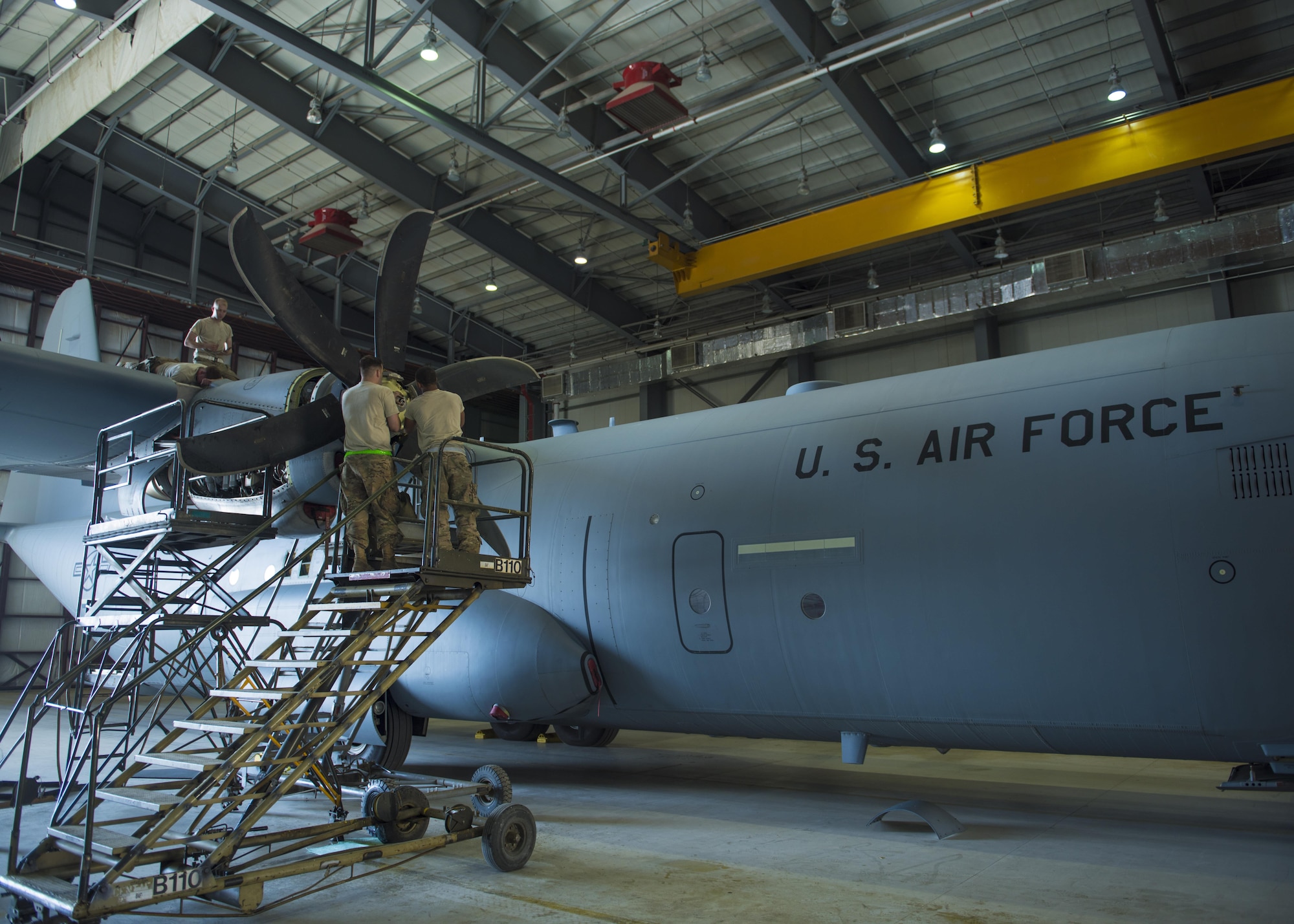 Airman from the 455th Expeditionary Aircraft Maintenance Squadron, install a new engine on a C-130J Super Hercules, June 27, 2016, Bagram Airfield, Afghanistan. Members of the 455th EAMXS replaced the old engine due to malfunction. (U.S. Air Force photo by Senior Airman Justyn M. Freeman)