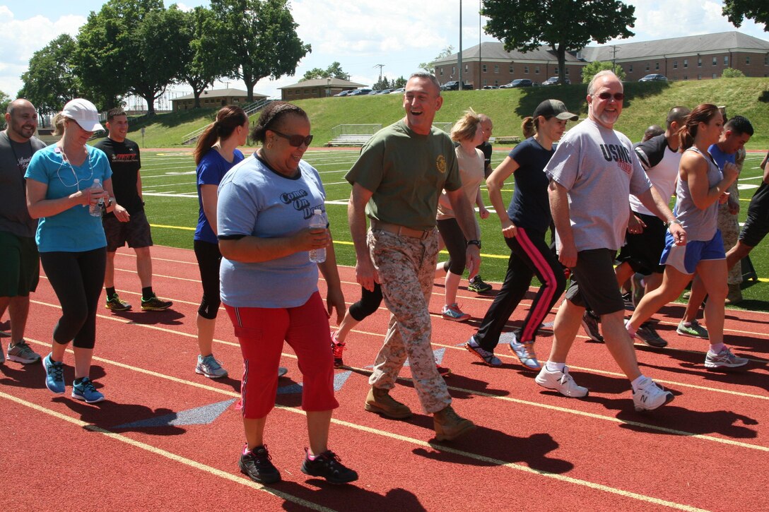 Maj. Gen. James Lukeman, Training and Education Command commanding general, starts a one-mile walk/run with TECOM Marines and civilian employees at Butler Stadium aboard Marine Corps Base Quantico June 8. The event was part of TECOM's first annual Health and Wellness Week, which ran June 6-June 10. 