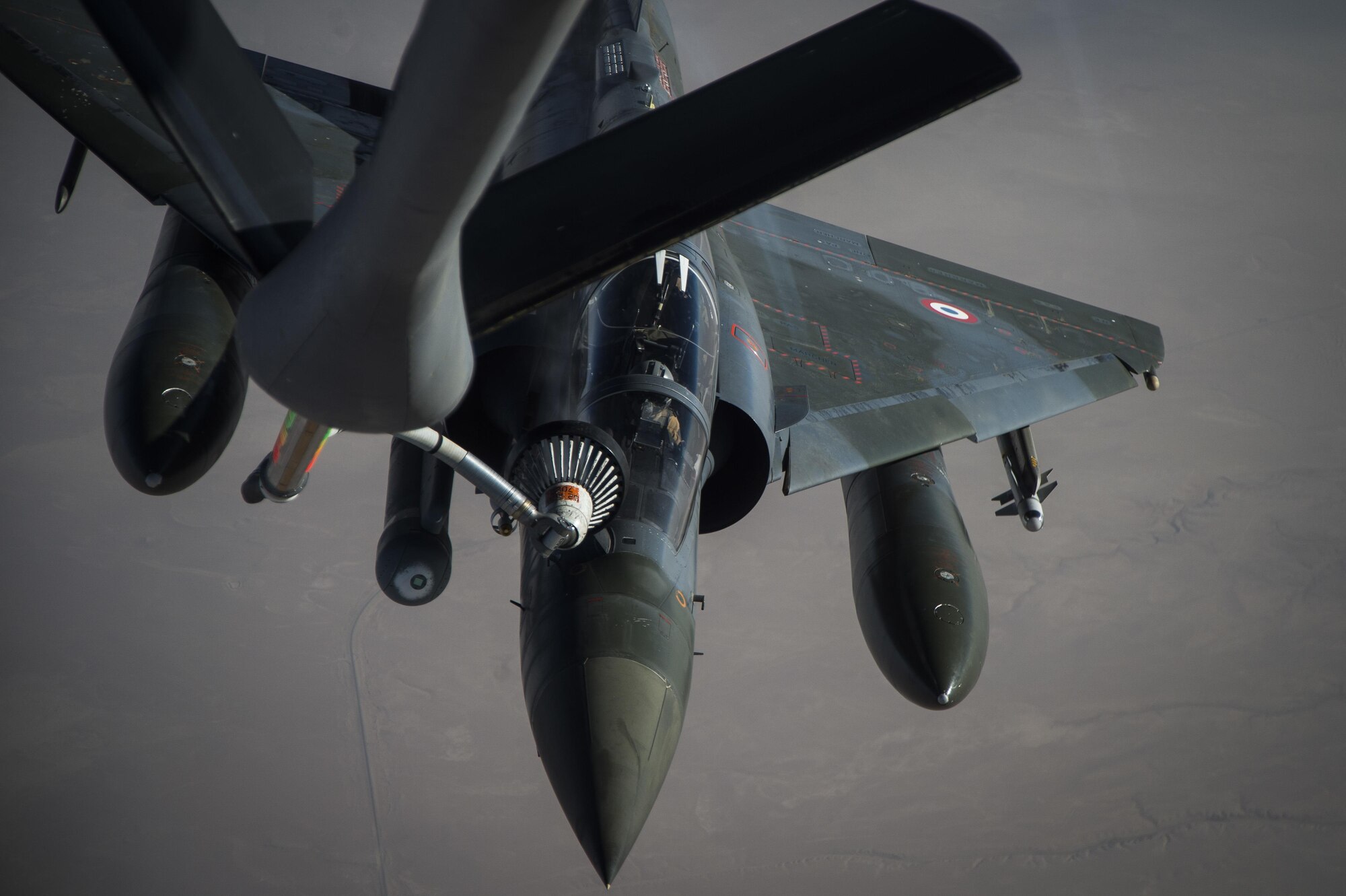 A French Air Force Mirage 2000 receives fuel from a KC-135 Stratotanker, assigned to the 340th Expeditionary Air Refueling Squadron, over Iraq, June 15, 2016. Airmen from the 340th EARS refueled the French Air Force's multirole fighter jet, the Mirage 2000 over Iraq, in support of Combined Joint Task Force-Operation Inherent Resolve. The U.S. and more than 60 coalition partners work together to eliminate the terrorist group ISIL and the threat they pose to Iraq and Syria.
(U.S. Air Force photo/Staff Sgt. Larry E. Reid Jr., Released)