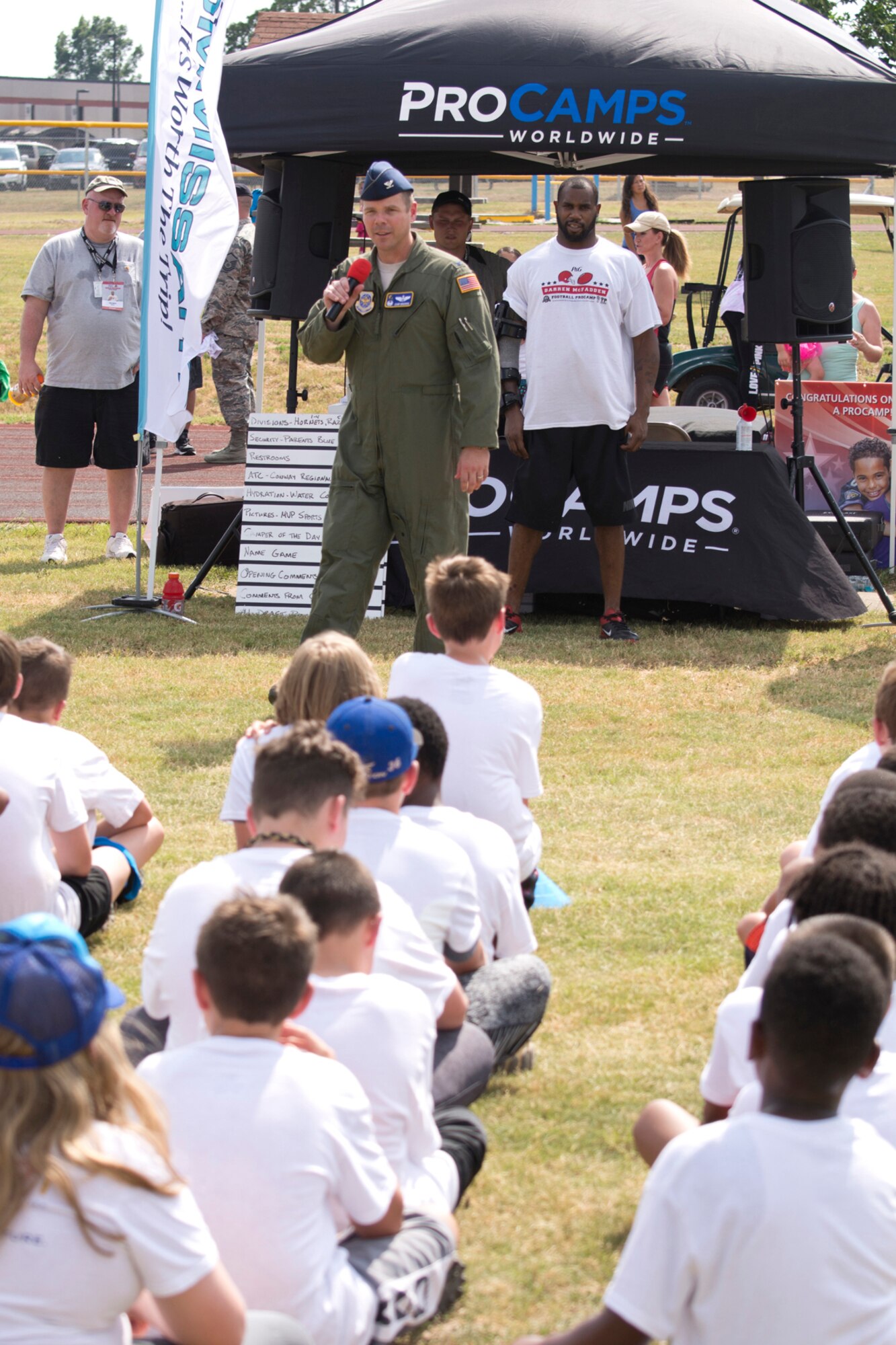 U.S. Air Force Col. Charles E. Brown Jr., commander, 19th Airlift Wing, welcomes former Arkansas Razorback Darren McFadden to Little Rock Air Force Base, Ark., June 23, 2016. McFadden, who is now a running back for the Dallas Cowboys of the National Football League, hosted the football ProCamp, which was free to military children in grades 1-8. (U.S. Air Force photo by Master Sgt. Jeff Walston/Released)
