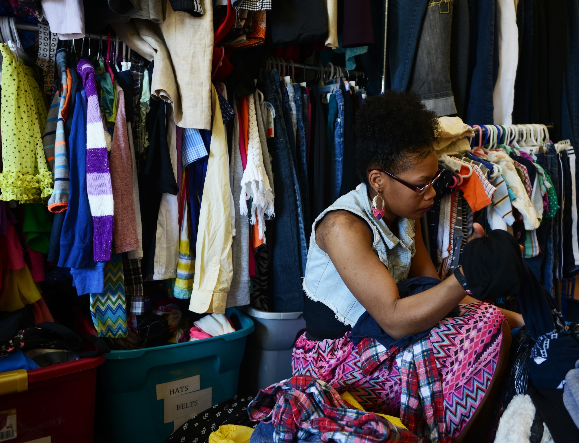 Paris Edington sorts donations in the back room of the Airman’s Attic at Ramstein Air Base, Germany, June 24, 2016. The Airman’s Attic gives away extra donations to charities around the local area. (U.S. Air Force Photo/ Airman 1st Class Joshua Magbanua)
