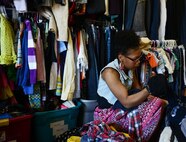 Paris Edington sorts donations in the back room of the Airman’s Attic at Ramstein Air Base, Germany, June 24, 2016. The Airman’s Attic gives away extra donations to charities around the local area. (U.S. Air Force Photo/ Airman 1st Class Joshua Magbanua)