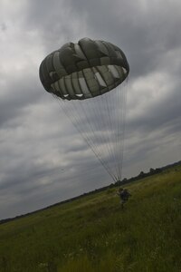 U.S. Army Reserve Paratroopers participate in an airborne operation hosted by the U.S. Army Civil Affairs & Psychological Operations Command (Airborne) at St. Mere Elise Drop Zone near Fort Bragg, N.C. on June 25, 2016.  USACAPOC (A), an Army Reserve unit, conducts airborne operations in order to maintain currency and proficiency. USACAPOC(A) supports the Army and Joint Force with strategic, operational, and tactical civil affairs, military information support, and information operations capabilities across the range of military operations. (U.S. Army photo by Staff Sgt. Felix R. Fimbres)