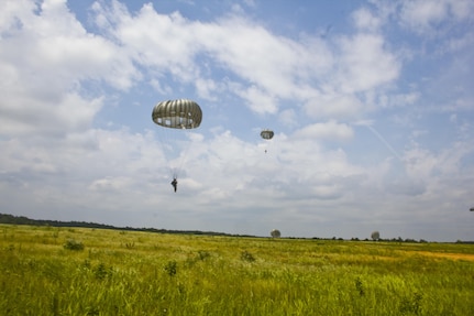 U.S. Army Reserve Paratroopers participate in an airborne operation hosted by the U.S. Army Civil Affairs & Psychological Operations Command (Airborne) at St. Mere Elise Drop Zone near Fort Bragg, N.C. on June 25, 2016.  USACAPOC (A), an Army Reserve unit, conducts airborne operations in order to maintain currency and proficiency. USACAPOC(A) supports the Army and Joint Force with strategic, operational, and tactical civil affairs, military information support, and information operations capabilities across the range of military operations. (U.S. Army photo by Staff Sgt. Felix R. Fimbres)