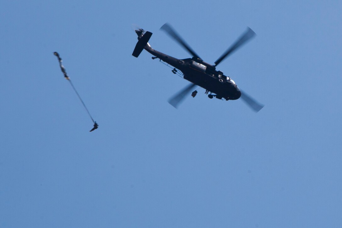 U.S. Army Reserve Paratroopers participate in an airborne operation hosted by the U.S. Army Civil Affairs & Psychological Operations Command (Airborne) at St. Mere Elise Drop Zone near Fort Bragg, N.C. on June 25, 2016.  USACAPOC (A), an Army Reserve unit, conducts airborne operations in order to maintain currency and proficiency. USACAPOC(A) supports the Army and Joint Force with strategic, operational, and tactical civil affairs, military information support, and information operations capabilities across the range of military operations. (U.S. Army photo by Staff Sgt. Felix R. Fimbres)