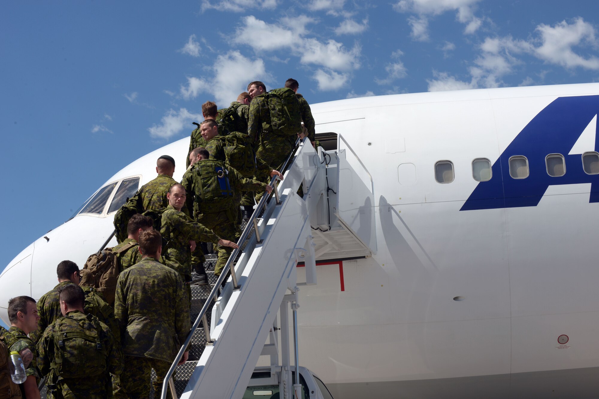 Members of the 41 Canadian Brigade Group depart Ellsworth Air Force Base, S.D., June 23, 2016. While in South Dakota, Task Force 41 assisted National Guard units during timber hauls, bridge repairs, and took part in lane training at West Camp Rapid with the 28th Civil Engineer Squadron during the South Dakota National Guard’s Golden Coyote exercise.  (U.S. Air Force photo by Airman Donald Knechtel/Released)