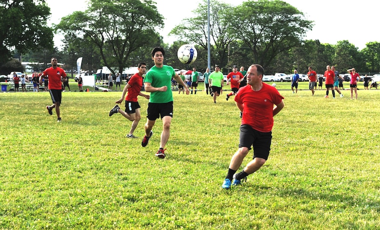 Members of the National Air and Space Intelligence Center compete in a soccer game during the Center's annual Sports Fest at the Jarvis Gym track on Wright-Patterson Air Force Base, Ohio, June 17, 2016. Sports Fest is a multi-sports elimination competition between the Center’s groups. (U.S. Air Force photo/Senior Airman William K. Veyon)