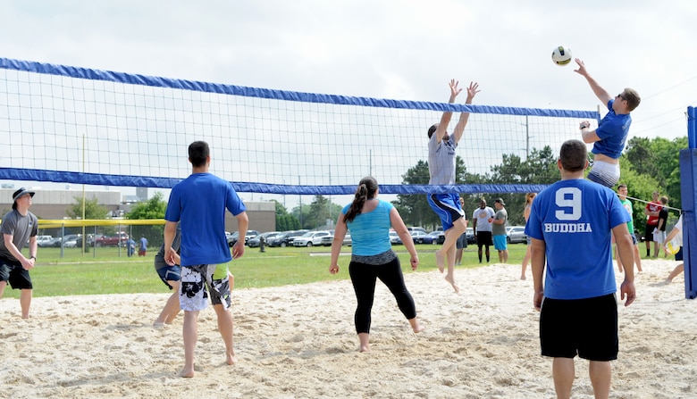 Members of the National Air and Space Intelligence Center compete in a volley ball game during the Center's annual Sports Fest on Wright-Patterson Air Force Base, Ohio, June 17, 2016. Sports Fest is a multi-sports elimination competition between the Center’s groups. (U.S. Air Force photo/Senior Airman William K. Veyon)