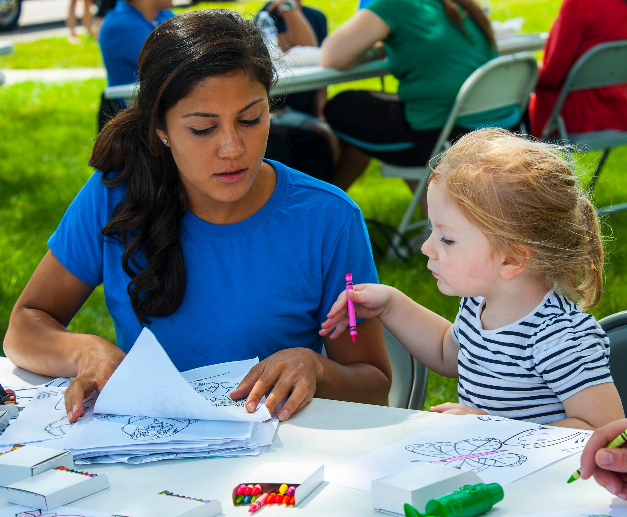 Members of the National Air and Space Intelligence Center family color pictures during the Center's annual Sports Fest on Wright-Patterson Air Force Base, Ohio, June 17, 2016. The fest included a variety of sports ranging from basketball to rally races along with activities to entertain young family members. (U.S. Air Force photo/Tech. Sgt. Eunique P. Thomas)