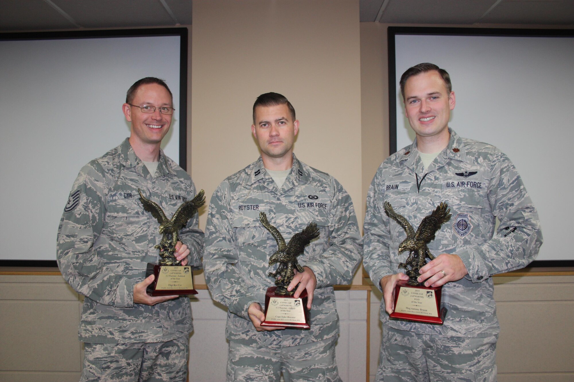 Three members of the Western Air Defense Sector are
recognized by Continental U.S. North American Aerospace Defense Command Region - First Air Force (CONR-1AF) as outstanding performers.  Tech. Sgt. Ryc Cyr, left, is the Command and Control (C2) Enlisted Warrior of the Year;
Capt. Tyler Royster, center, is the C2 Officer Warrior of the Year; and Maj. Antony Braun, right, is the Field Grade Officer of the Year.  Also, WADS was named the CONR-1AF Command and Control Unit of the Year.  
