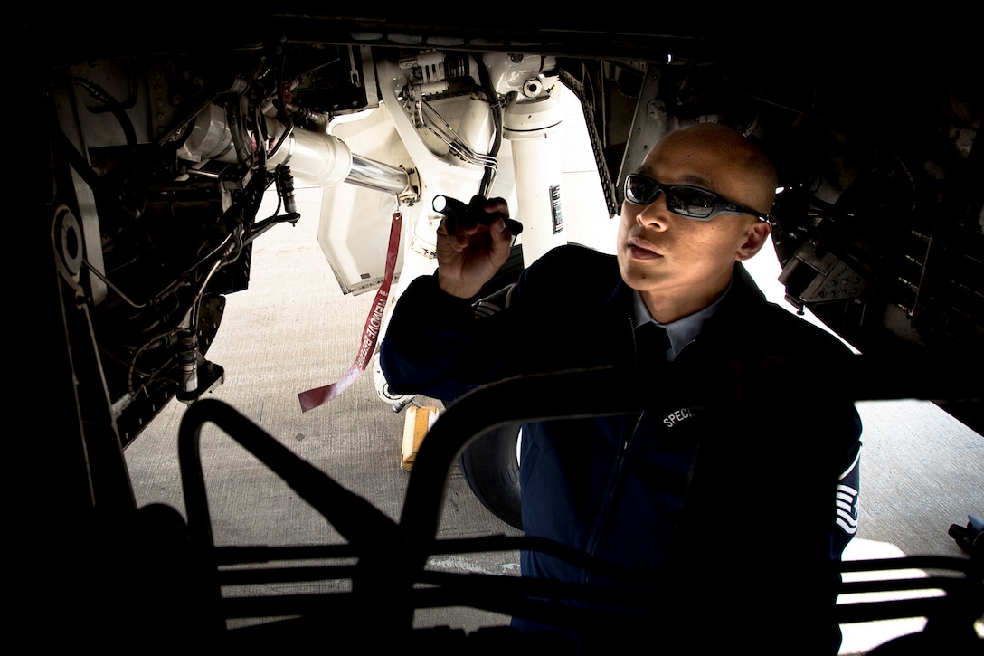 Air Force Master Sgt. Kristofer Reyes, a 99th Airlift Squadron flight engineer, inspects a C-37A at Joint Base Andrews, Md., June 7, 2016. Reyes is responsible for monitoring and maintaining the mechanical and electrical systems on the C-37A, which is a highly modified Gulfstream G5, and is used, along with the VC-25, C-20B, C-37B, C-32A and C-40B for executive airlift of the U.S. president, vice president, cabinet members, combatant commanders, and other senior military and elected leaders. Air Force photo/Senior Master Sgt. Kevin Wallace