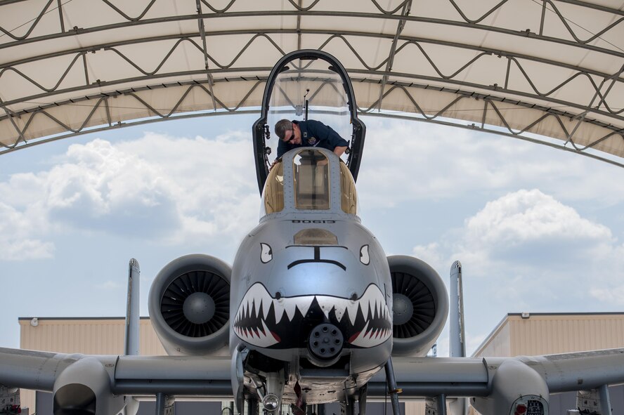 U.S. Air Force Col. Thomas Kunkel, 23d Wing commander, cleans the canopy of an A-10C Thunderbolt II, June 27, 2016, at Moody Air Force Base, Ga. During his visit to the 23d Aircraft Maintenance Squadron, Kunkel performed an inspection, refueled and prepared the A-10 for flight. (U.S. Air Force photo by Airman 1st Class Lauren M. Hunter/Released)