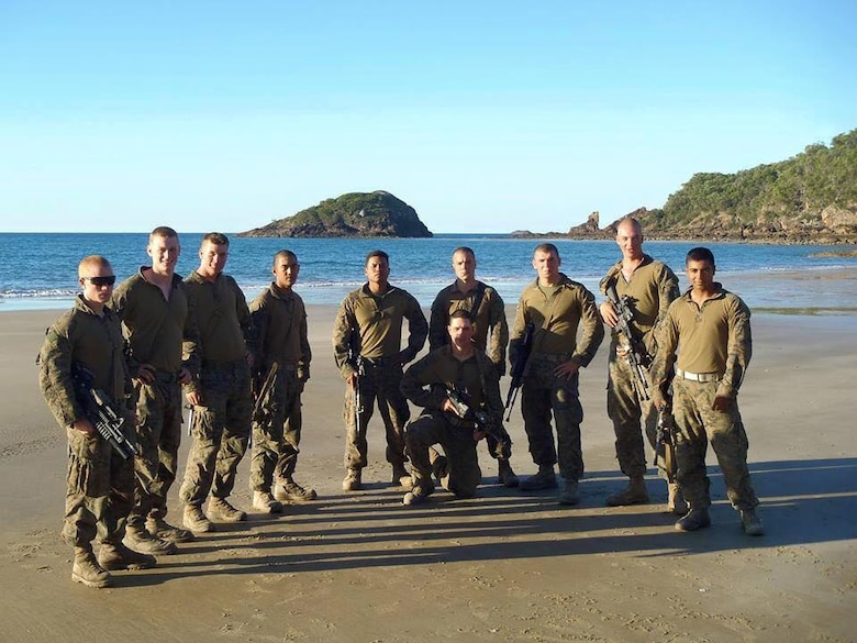 Sergeant Steward Tauch (middle) poses with members of 2nd Squad, also known as Joker Company, 2nd Platoon, 2nd Battalion, 4th Marine Regiment, from Marine Corps Base Camp Pendleton, after a day of training in Australia, Jan. 2014. 