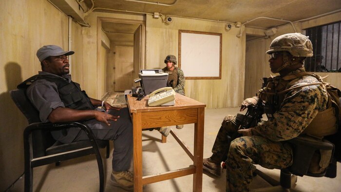 Marines with Company B, 1st Battalion, 2nd Marine Regiment, train in a simulated African village where they conduct patrols and defend a village from insurgents operating nearby during a training exercise at Marine Corps Base Camp Lejeune, N.C., June 23, 2016. Marines were able to practice tactics, communication within the unit, and combat readiness in a realistic training scenario, which better prepared them for a deployed environment. 